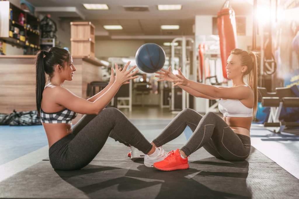 Two Girl Exercising At The Gym