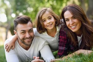 Happy young family in a urban park