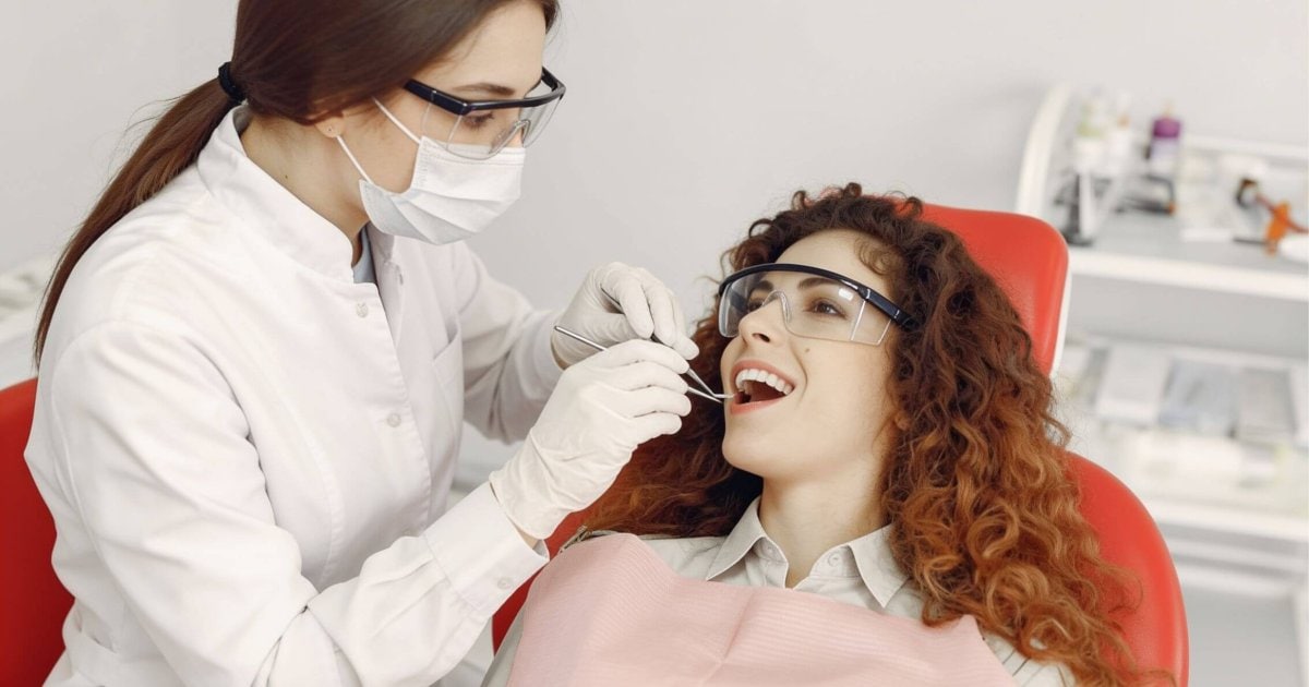 North Lakes dentist examining a patient's mouth