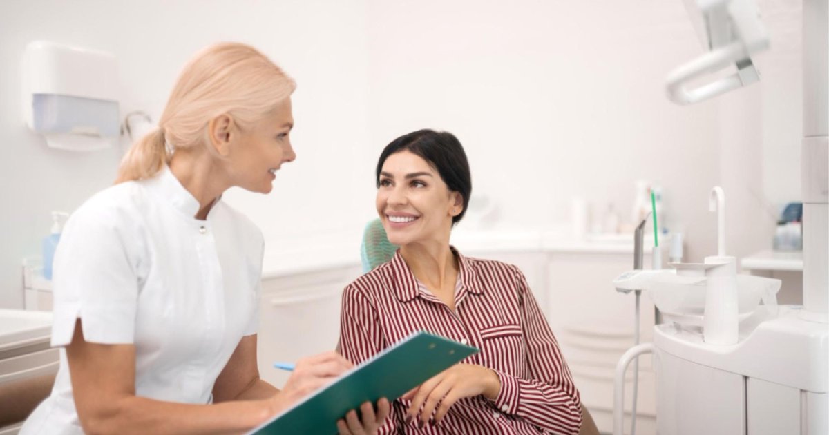 dentist speaking with a patient during a consultation in North Lakes